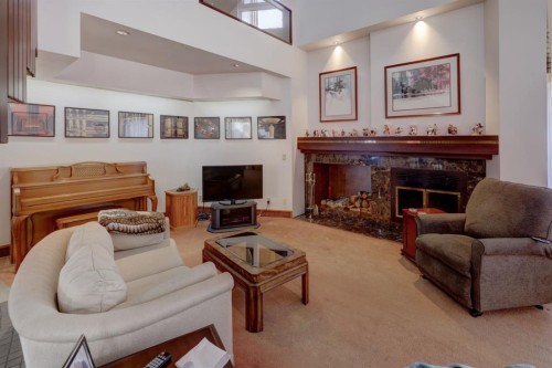 109 5Th Ave West, Hanna, AB - Indoor Photo Showing Living Room With Fireplace