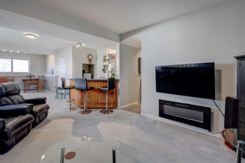24 Willow Point, Drumheller, AB - Indoor Photo Showing Living Room With Fireplace