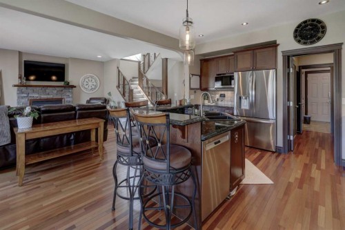 12 Willow Point, Drumheller, AB - Indoor Photo Showing Kitchen With Fireplace With Double Sink