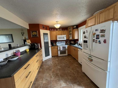 3917 52 Street, Taber, AB - Indoor Photo Showing Kitchen With Double Sink