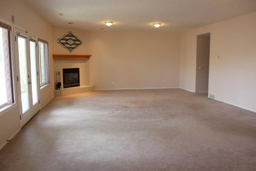 71 Park Place West, Brooks, AB - Indoor With Fireplace