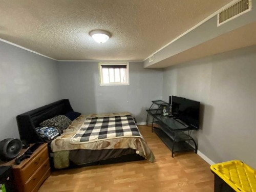 23 Pine Avenue West, Brooks, AB - Indoor Photo Showing Bedroom