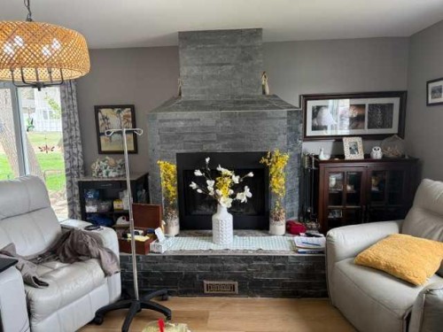 148 4 Street, Drumheller, AB - Indoor Photo Showing Living Room With Fireplace