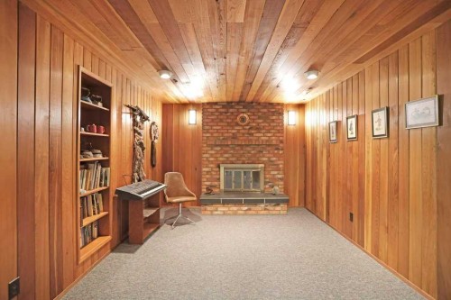 160 Ingram Park Drive, Brooks, AB - Indoor Photo Showing Other Room With Fireplace