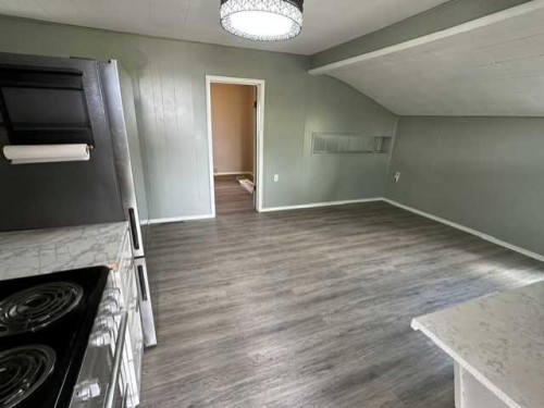 320 Railway Avenue West, Hanna, AB - Indoor Photo Showing Other Room With Fireplace