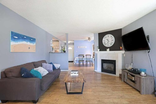 320 3 Street West, Brooks, AB - Indoor Photo Showing Living Room With Fireplace