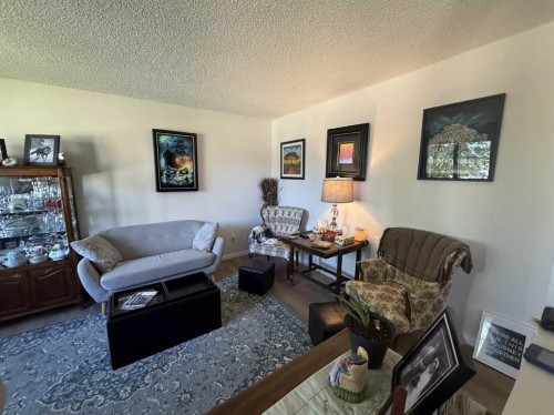 111 Shacker Crescent, Hanna, AB - Indoor Photo Showing Living Room With Fireplace