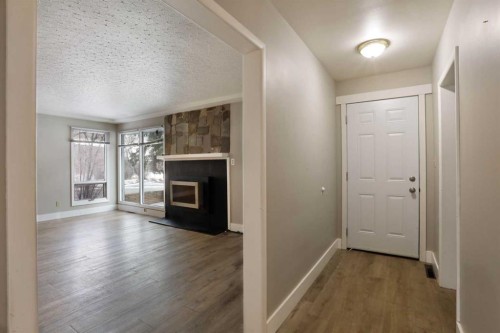 508 2 Avenue West, Brooks, AB - Indoor Photo Showing Other Room With Fireplace