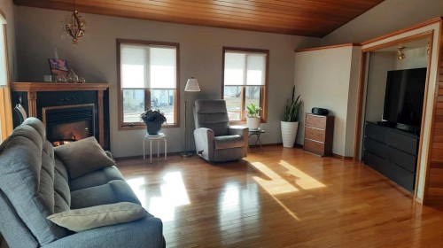 241 4 Street, Drumheller, AB - Indoor Photo Showing Living Room With Fireplace