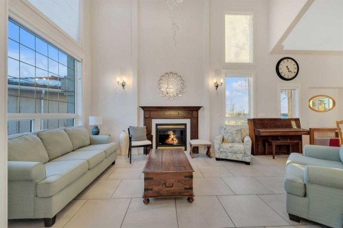 25 Ashmore Close, Red Deer, AB - Indoor Photo Showing Living Room With Fireplace