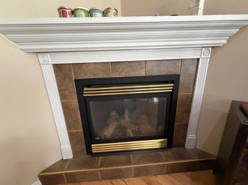 42 A Red Deer Avenue, Drumheller, AB - Indoor Photo Showing Living Room With Fireplace