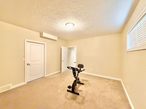 42 A Red Deer Avenue, Drumheller, AB - Indoor Photo Showing Gym Room