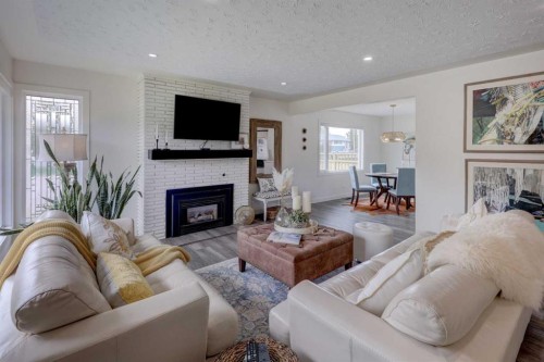 809 Riverside Drive East, Drumheller, AB - Indoor Photo Showing Living Room With Fireplace