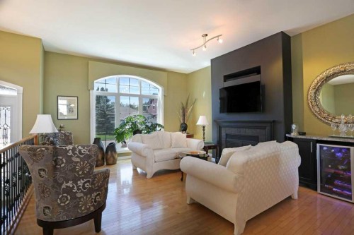 96 Greystone Close East, Brooks, AB - Indoor Photo Showing Living Room With Fireplace