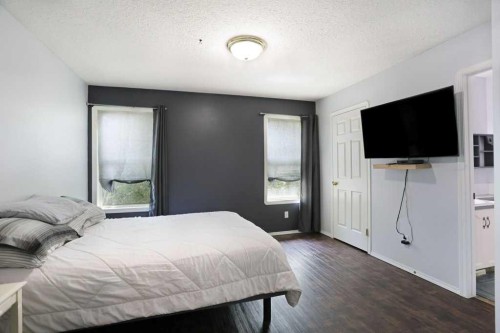 68 Upland Street, Brooks, AB - Indoor Photo Showing Bedroom