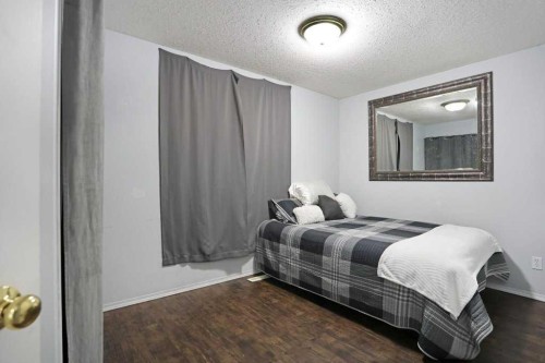 68 Upland Street, Brooks, AB - Indoor Photo Showing Bedroom