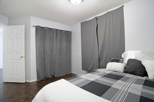 68 Upland Street, Brooks, AB - Indoor Photo Showing Bedroom