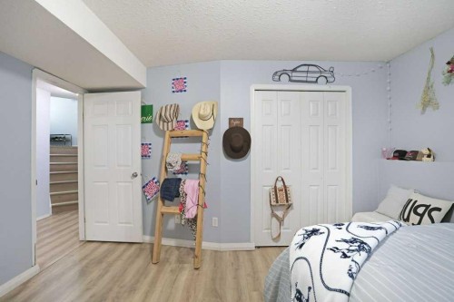 68 Upland Street, Brooks, AB - Indoor Photo Showing Bedroom