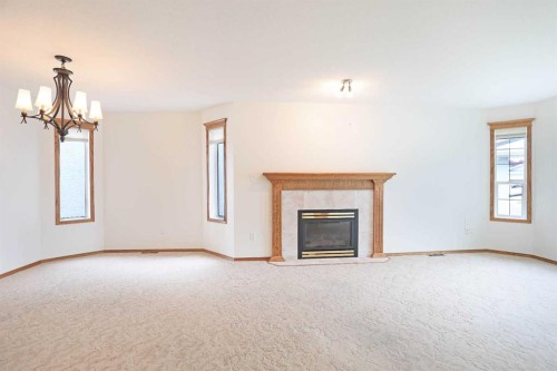 63 Lu-Dor Close East, Brooks, AB - Indoor Photo Showing Living Room With Fireplace
