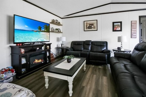 327 3 Street, Hays, AB - Indoor Photo Showing Living Room With Fireplace