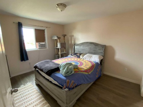 1708 2 Avenue East, Brooks, AB - Indoor Photo Showing Bedroom