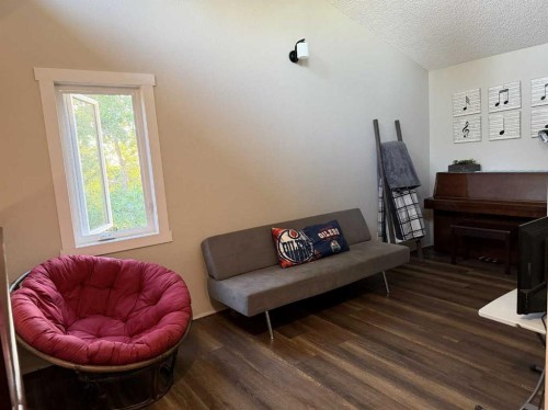 83002 Rge Rd 194, Coaldale, AB - Indoor Photo Showing Living Room With Fireplace