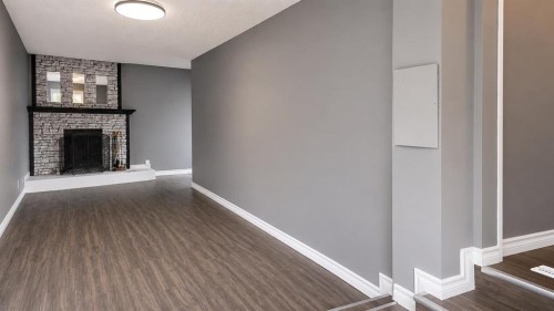 137 Big Hill Place, Airdrie, AB - Indoor Photo Showing Other Room With Fireplace