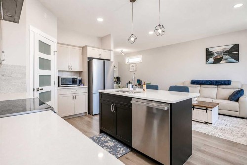1614 2 Avenue East, Brooks, AB - Indoor Photo Showing Kitchen With Stainless Steel Kitchen With Double Sink With Upgraded Kitchen