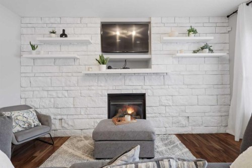 113 Weddell Crescent, Red Deer, AB - Indoor Photo Showing Living Room With Fireplace