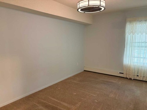 209-4514 54 Avenue, Olds, AB - Indoor Photo Showing Other Room