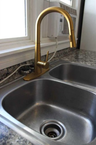 23 Pine Avenue West, Brooks, AB - Indoor Photo Showing Kitchen With Double Sink