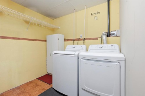 76 Crystalridge Crescent, Okotoks, AB - Indoor Photo Showing Laundry Room