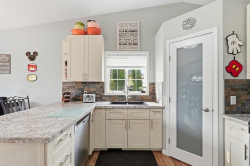 76 Crystalridge Crescent, Okotoks, AB - Indoor Photo Showing Kitchen With Double Sink