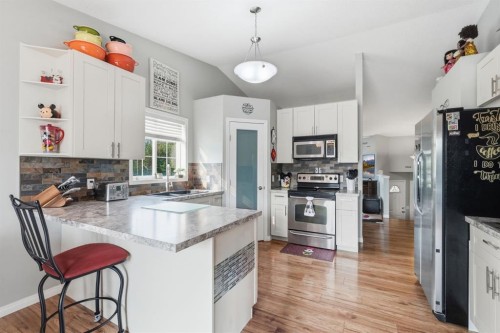 76 Crystalridge Crescent, Okotoks, AB - Indoor Photo Showing Kitchen With Stainless Steel Kitchen With Upgraded Kitchen