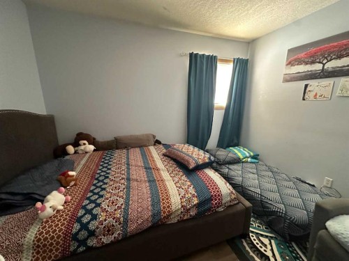 200 Upland Boulevard West, Brooks, AB - Indoor Photo Showing Bedroom