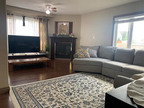 1137 25 Street, Wainwright, AB - Indoor Photo Showing Living Room With Fireplace