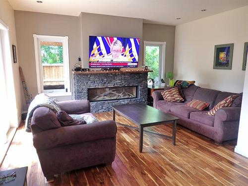 4802 53 Avenue, Vermilion, AB - Indoor Photo Showing Living Room With Fireplace