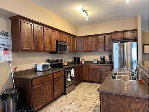 407 6 Street North, Marwayne, AB - Indoor Photo Showing Kitchen With Double Sink