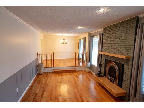 402 3 Street, Wainwright, AB - Indoor With Fireplace
