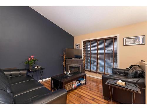 5302 50 Street, Kitscoty, AB - Indoor Photo Showing Living Room With Fireplace