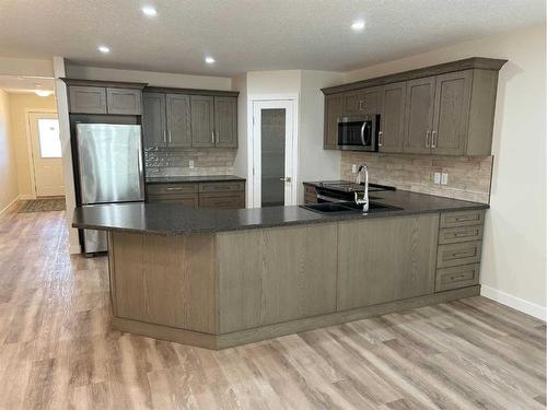 4911 Riverside Drive, Vermilion, AB - Indoor Photo Showing Kitchen With Stainless Steel Kitchen With Double Sink