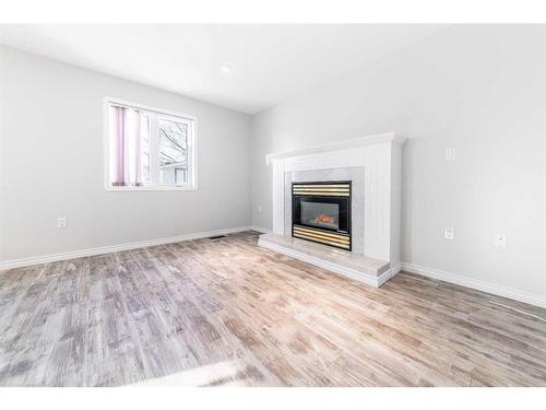 5907 41 Street, Lloydminster, AB - Indoor Photo Showing Living Room With Fireplace