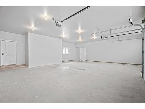 16 Sandpiper Estate, Sandy Beach, AB - Indoor Photo Showing Garage