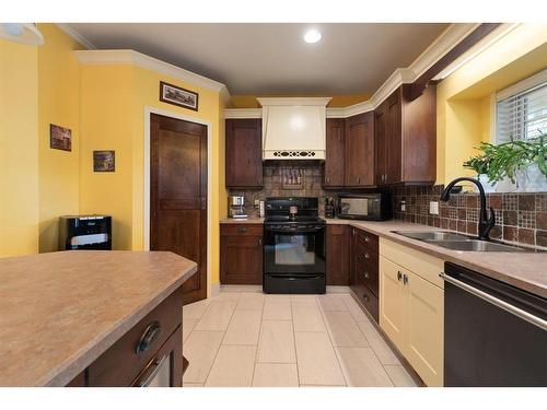 6005 23 Street, Lloydminster, AB - Indoor Photo Showing Kitchen With Double Sink
