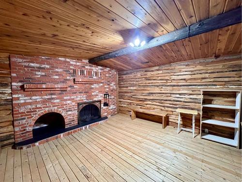 473035 Hwy 41, Rural Vermilion River, County Of, AB - Indoor Photo Showing Other Room With Fireplace