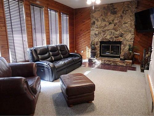 5820 Park Drive, Vermilion, AB - Indoor Photo Showing Living Room With Fireplace