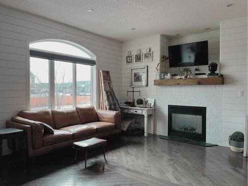818 29 Street, Wainwright, AB - Indoor Photo Showing Living Room With Fireplace