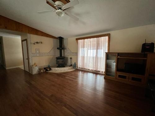 440027 Rng Rd 50A, Rural Wainwright No. 61, M.D. Of, AB - Indoor Photo Showing Other Room With Fireplace