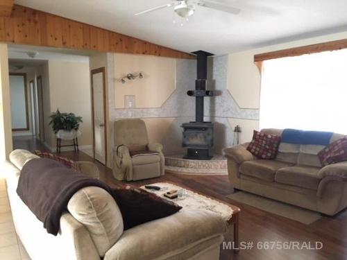 440027 Rng Rd 50A, Rural Wainwright No. 61, M.D. Of, AB - Indoor Photo Showing Living Room With Fireplace