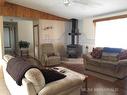 440027 Rng Rd 50A, Rural Wainwright No. 61, M.D. Of, AB  - Indoor Photo Showing Living Room With Fireplace 